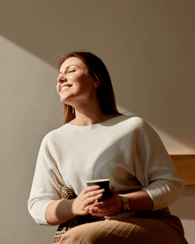 happy-woman-enjoying-morning-coffee-cafe